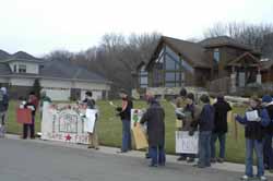 [PICTURE -UW students sing Rudolph the Union Reindeer]